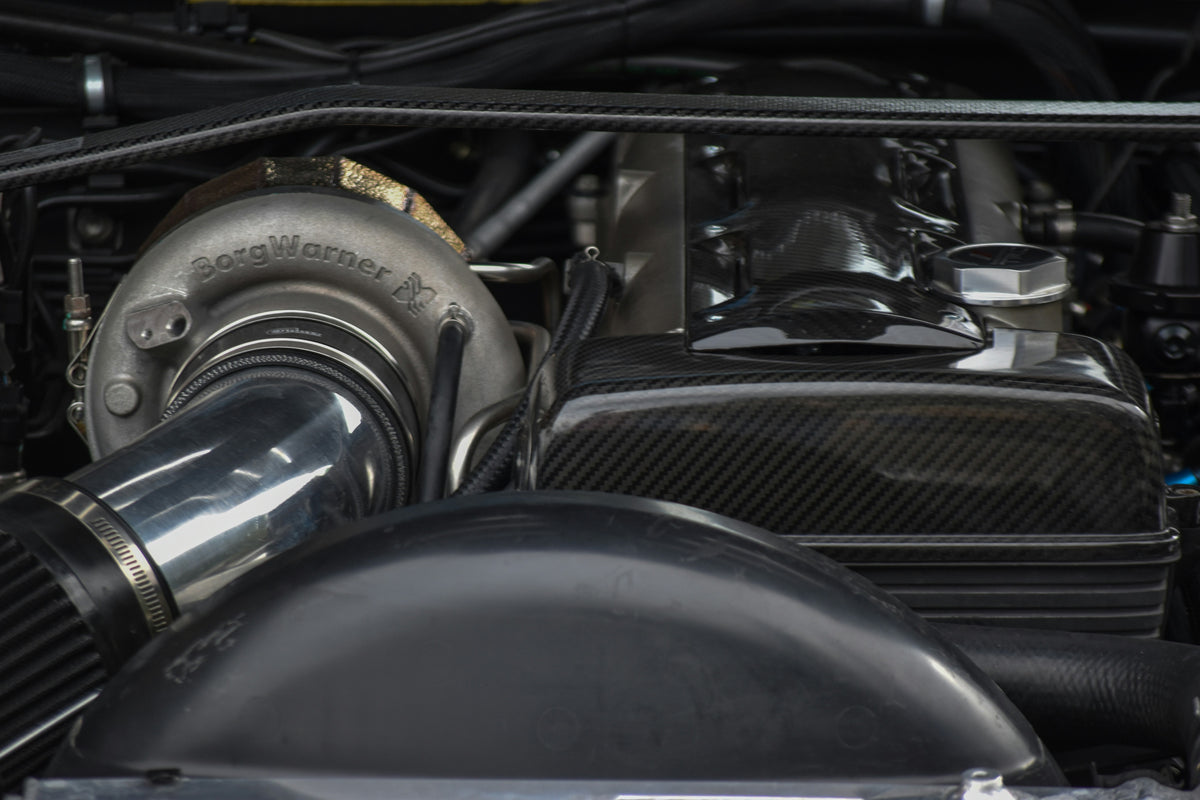 Close-up of turbocharger hardware on a 2JZ installation