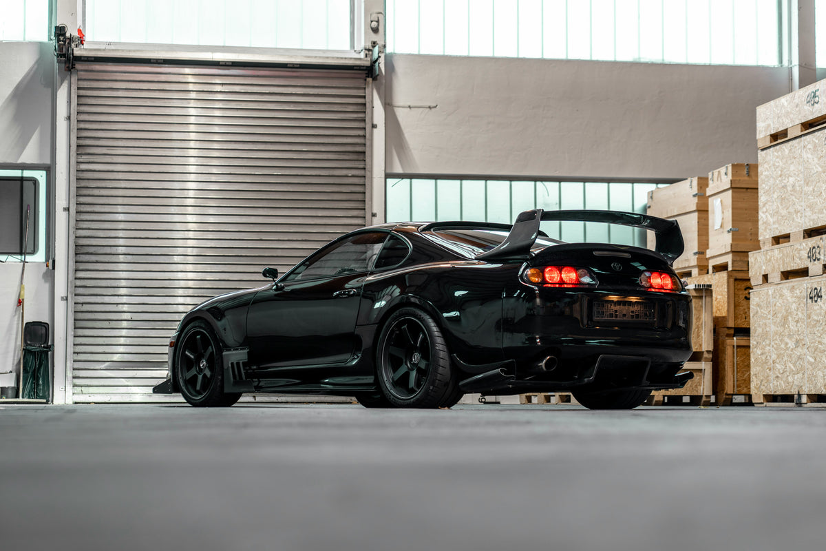 Rear view of a black MK4 Toyota Supra