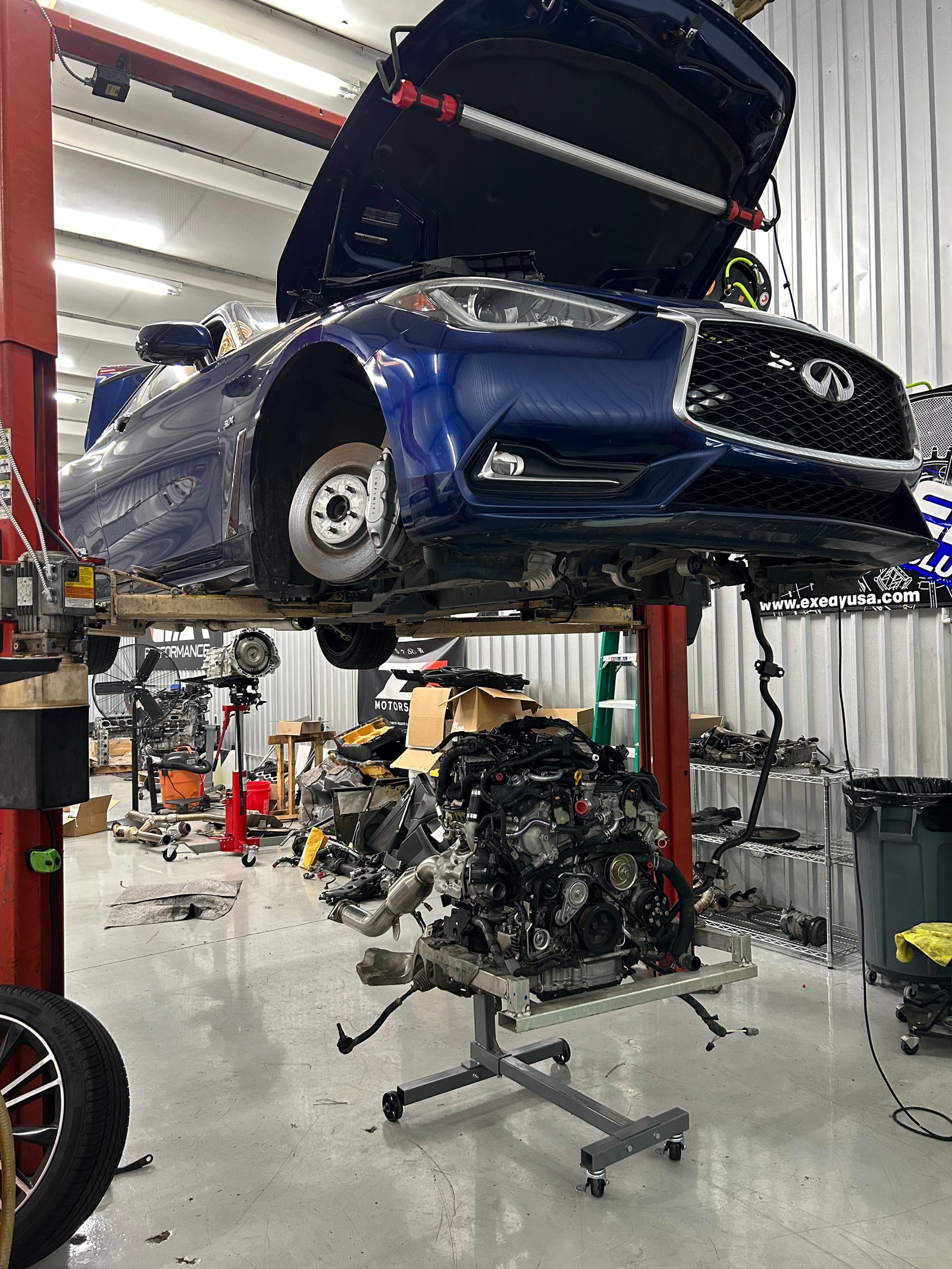 Later VR30-equipped Infiniti Q60 on a lift during engine-out work