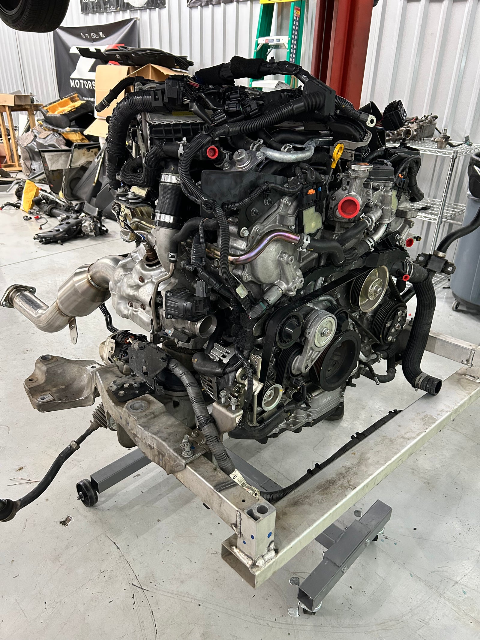 VR30 engine with downpipes for a compatible VR30-equipped Infiniti Q50