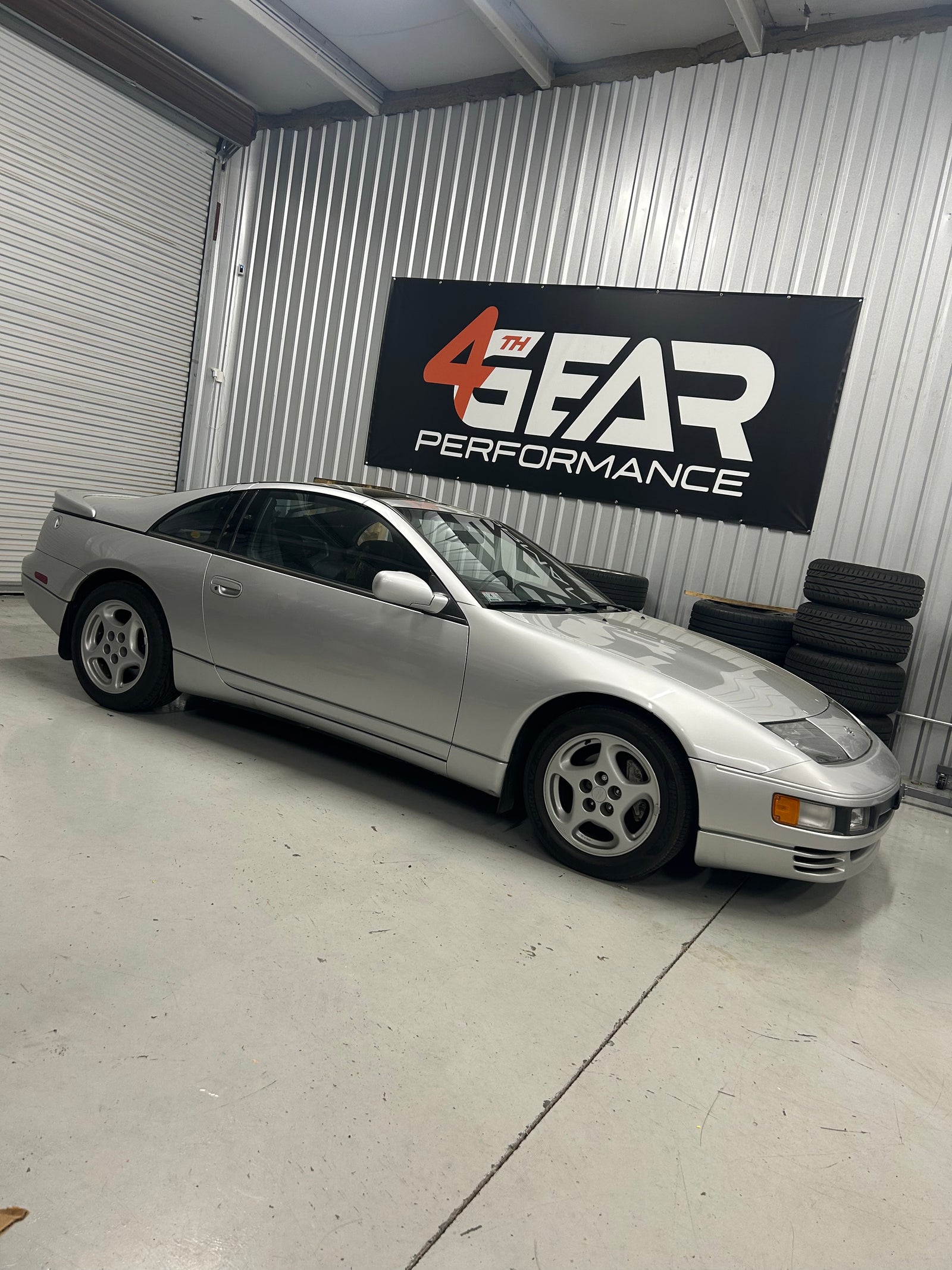 Silver Z32 Nissan 300ZX inside the 4th Gear Performance workshop