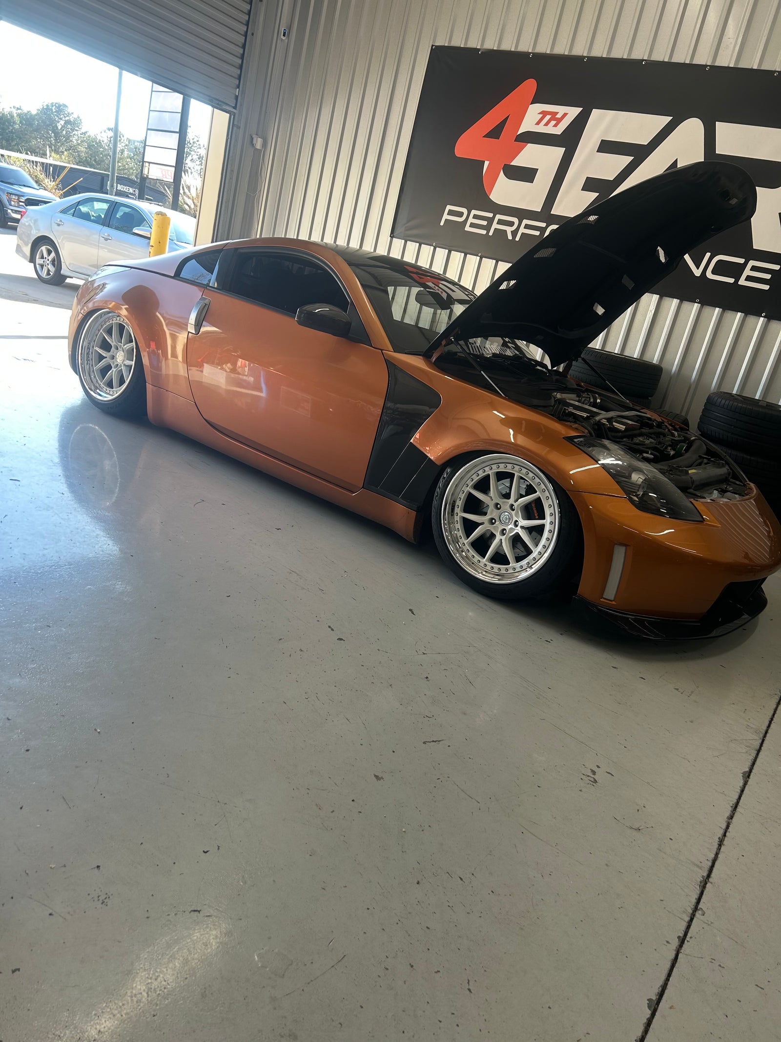 Modified Nissan Z33 350Z with its hood open